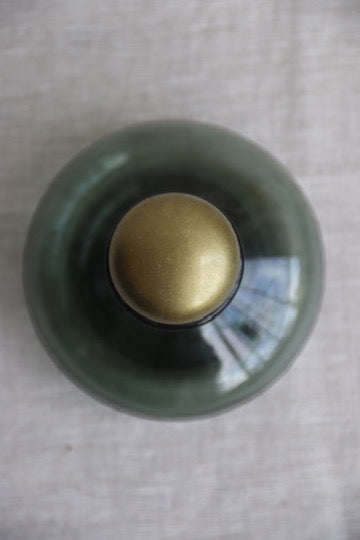 Blue bottle with gold top