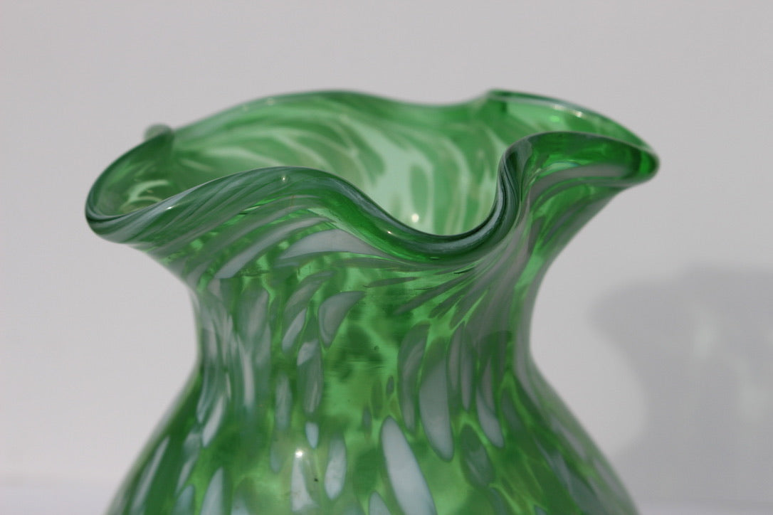 Green with white spatter glass hand blown vase with wavy rim