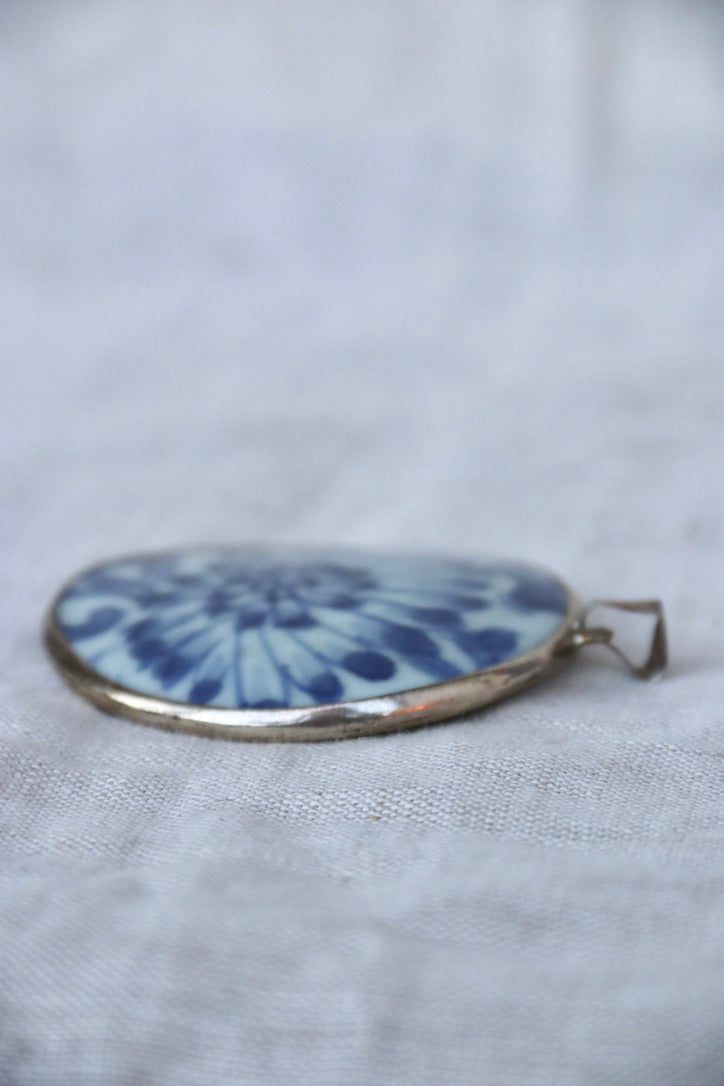 blue and white porcelain shard and silver pendant