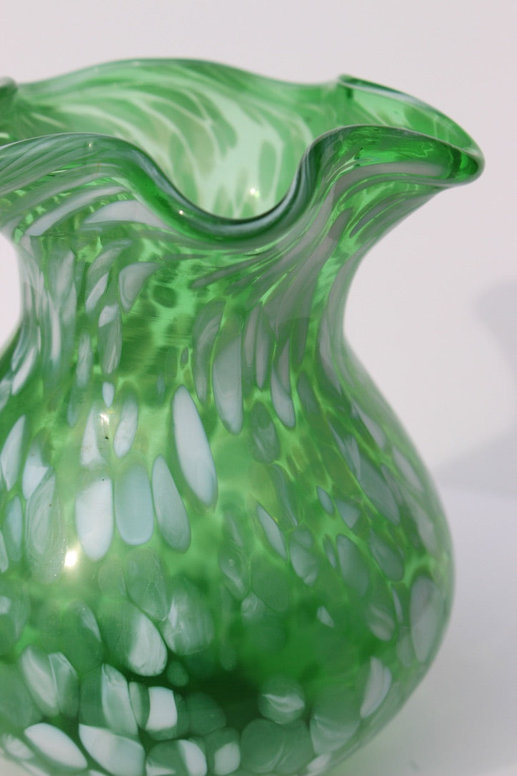 Green with white spatter glass hand blown vase with wavy rim