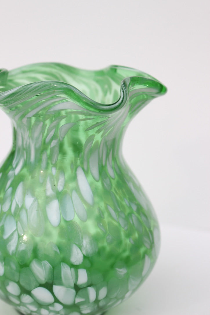 Green with white spatter glass hand blown vase with wavy rim