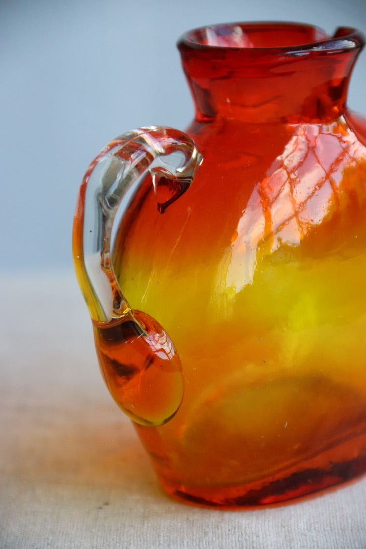 Hand Blown red and orange vase with handle