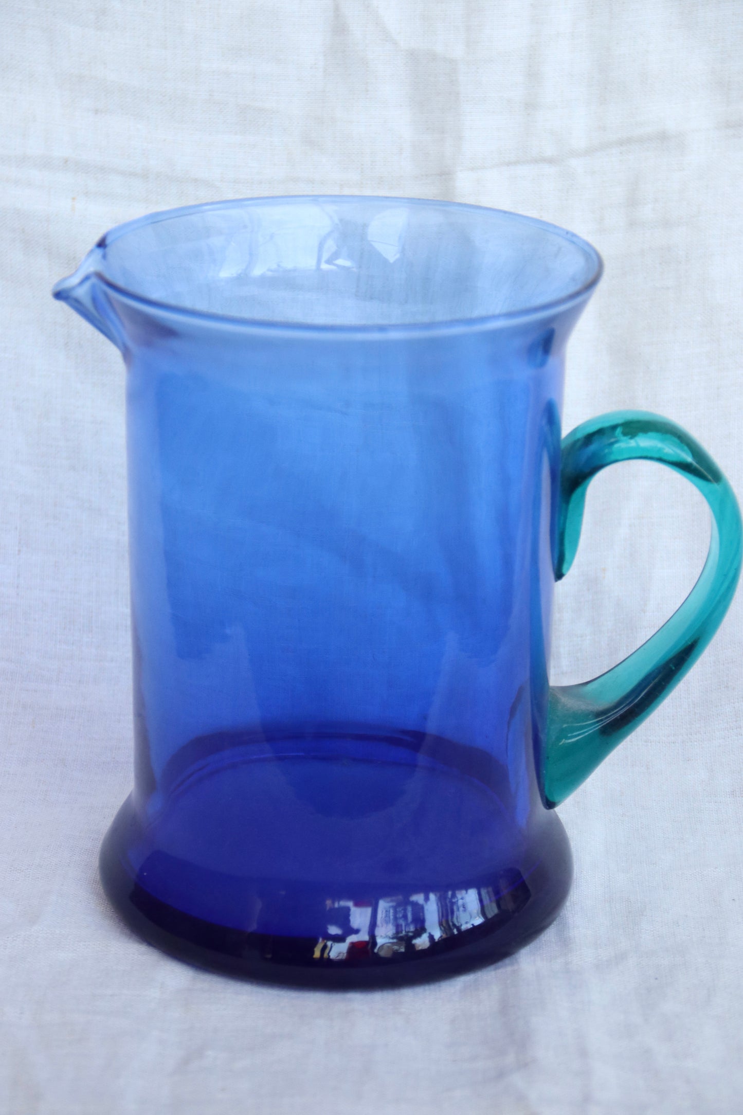 Vintage Blue Glass Pitcher with Teal Handle