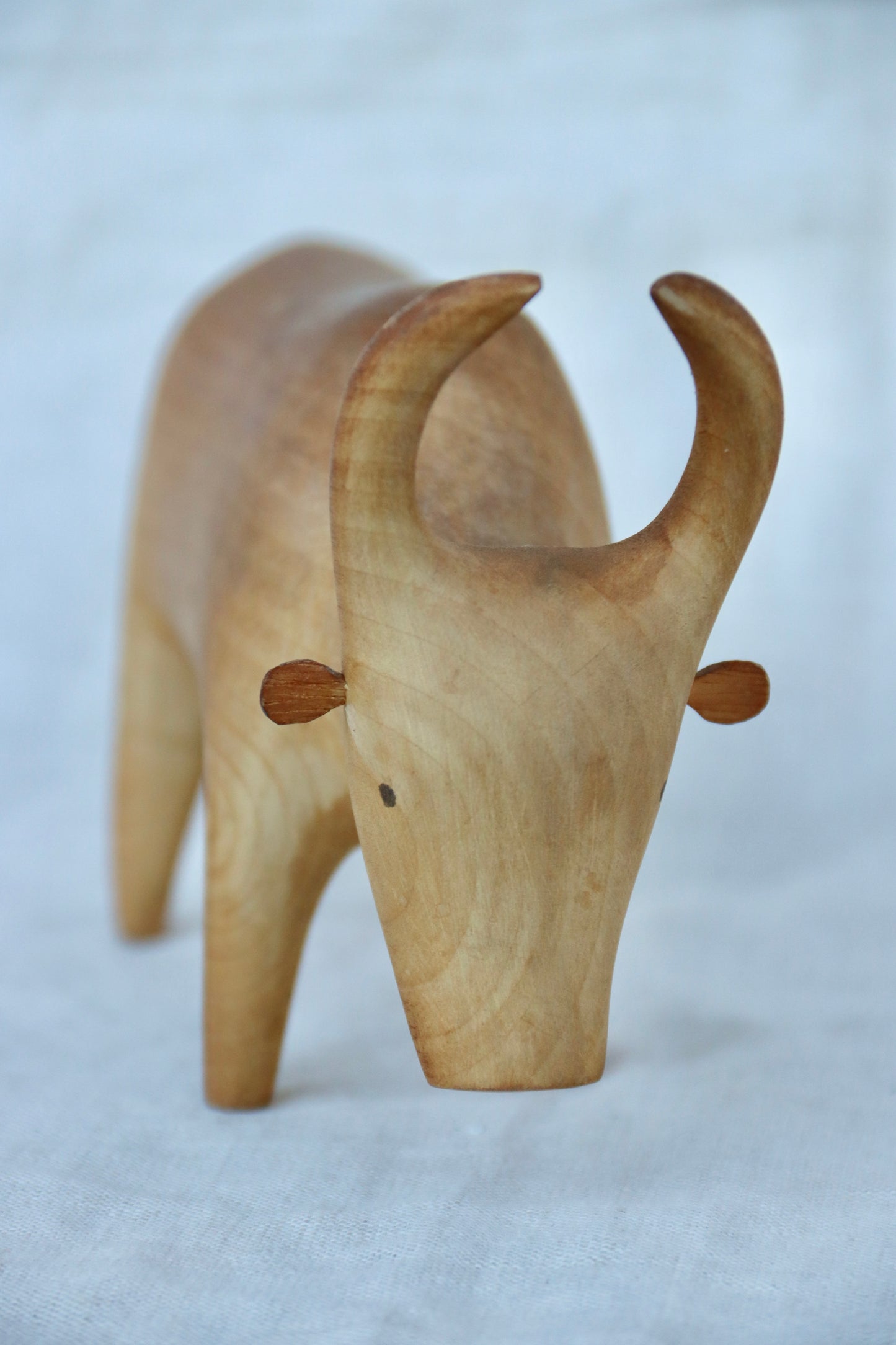 hand-carved wooden Brahma bull figurine