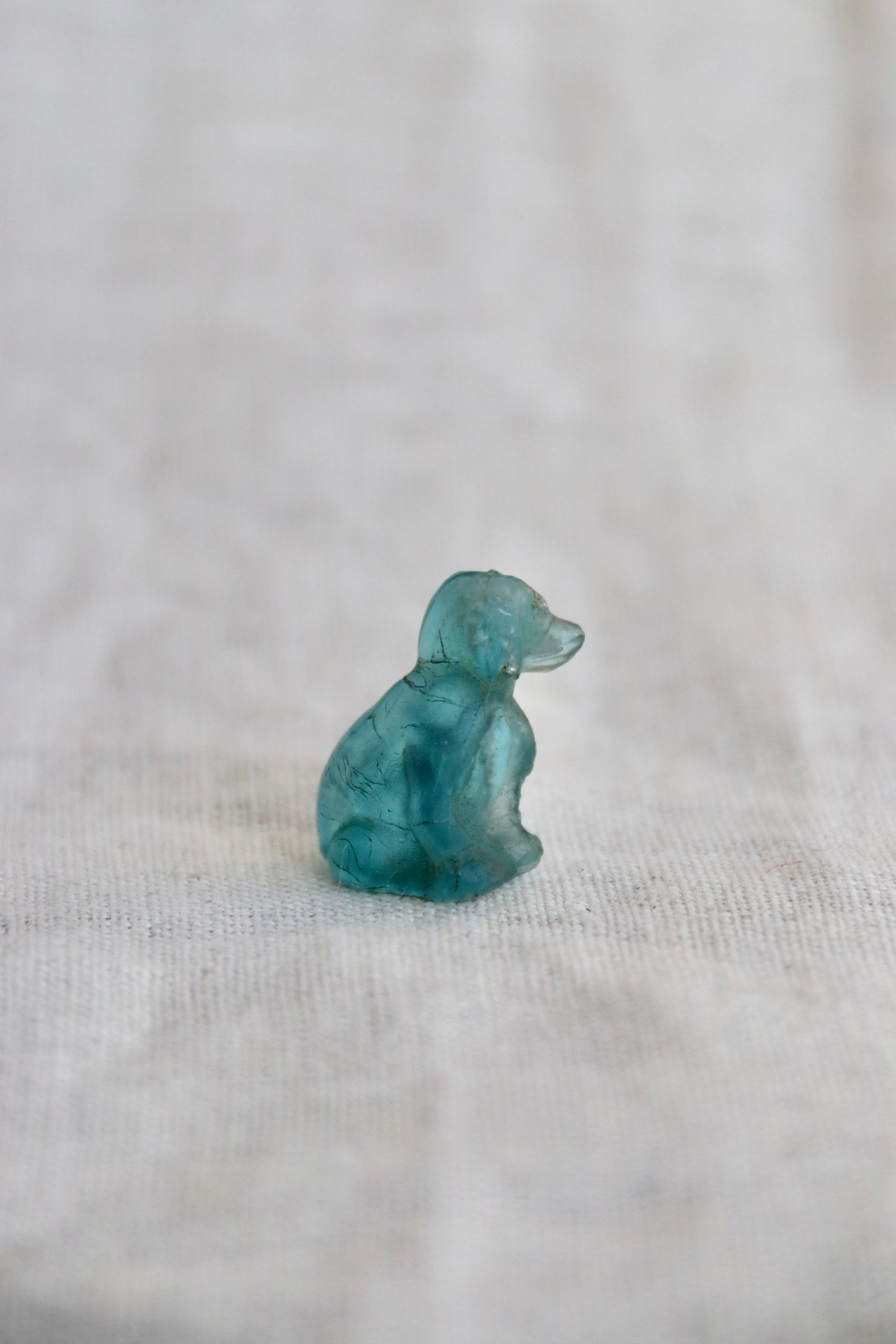 Miniature blue glass dog with broken nose