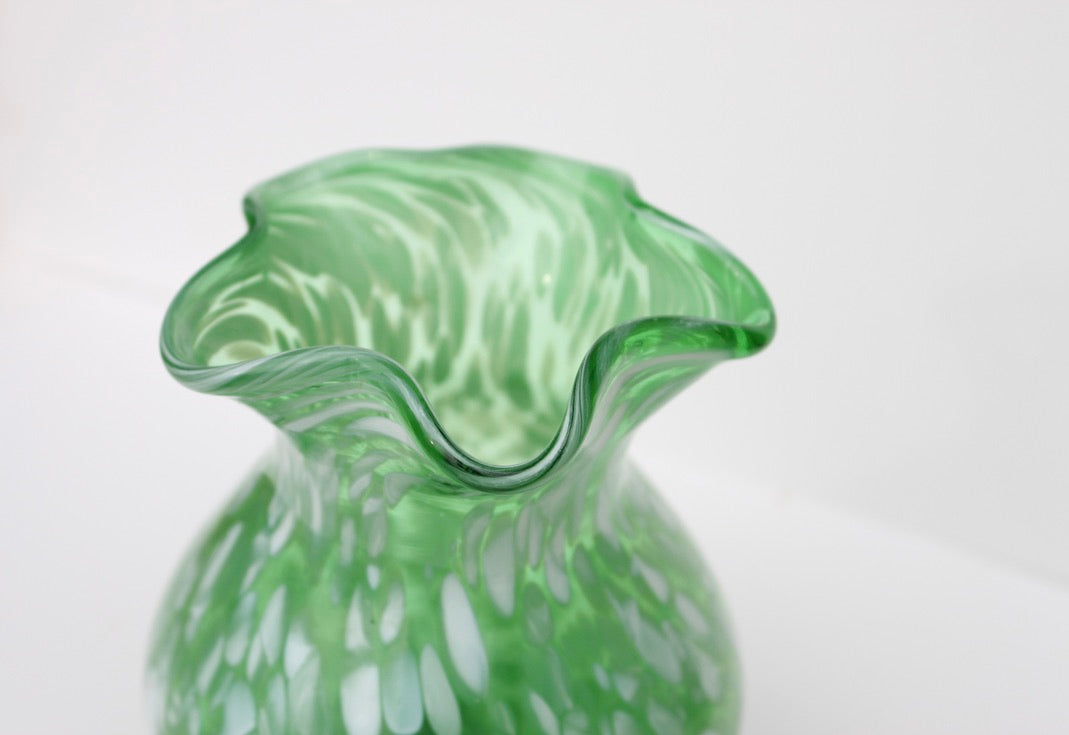 Green with white spatter glass hand blown vase with wavy rim