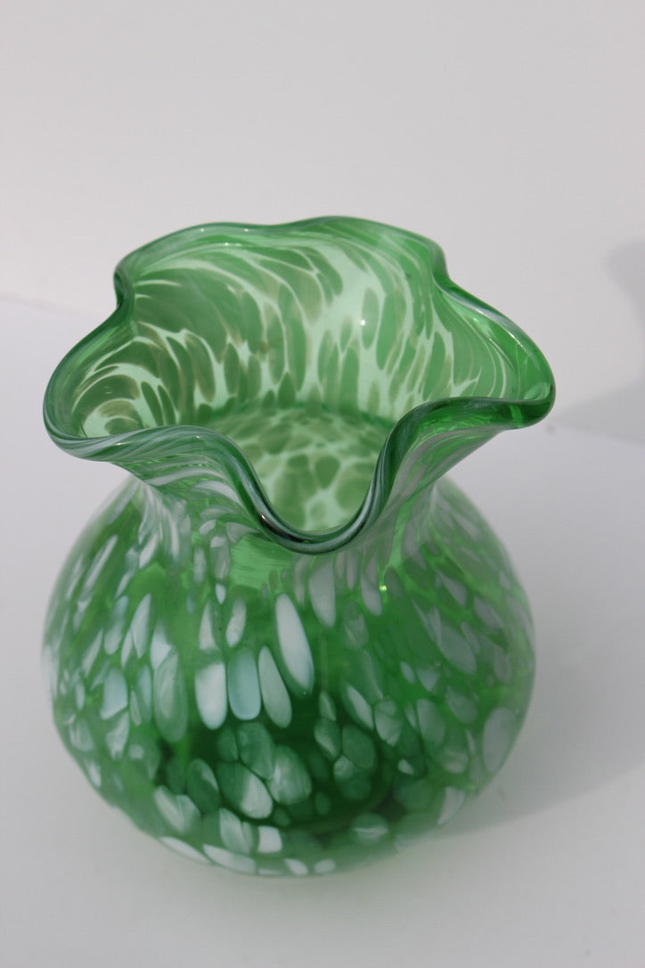 Green with white spatter glass hand blown vase with wavy rim