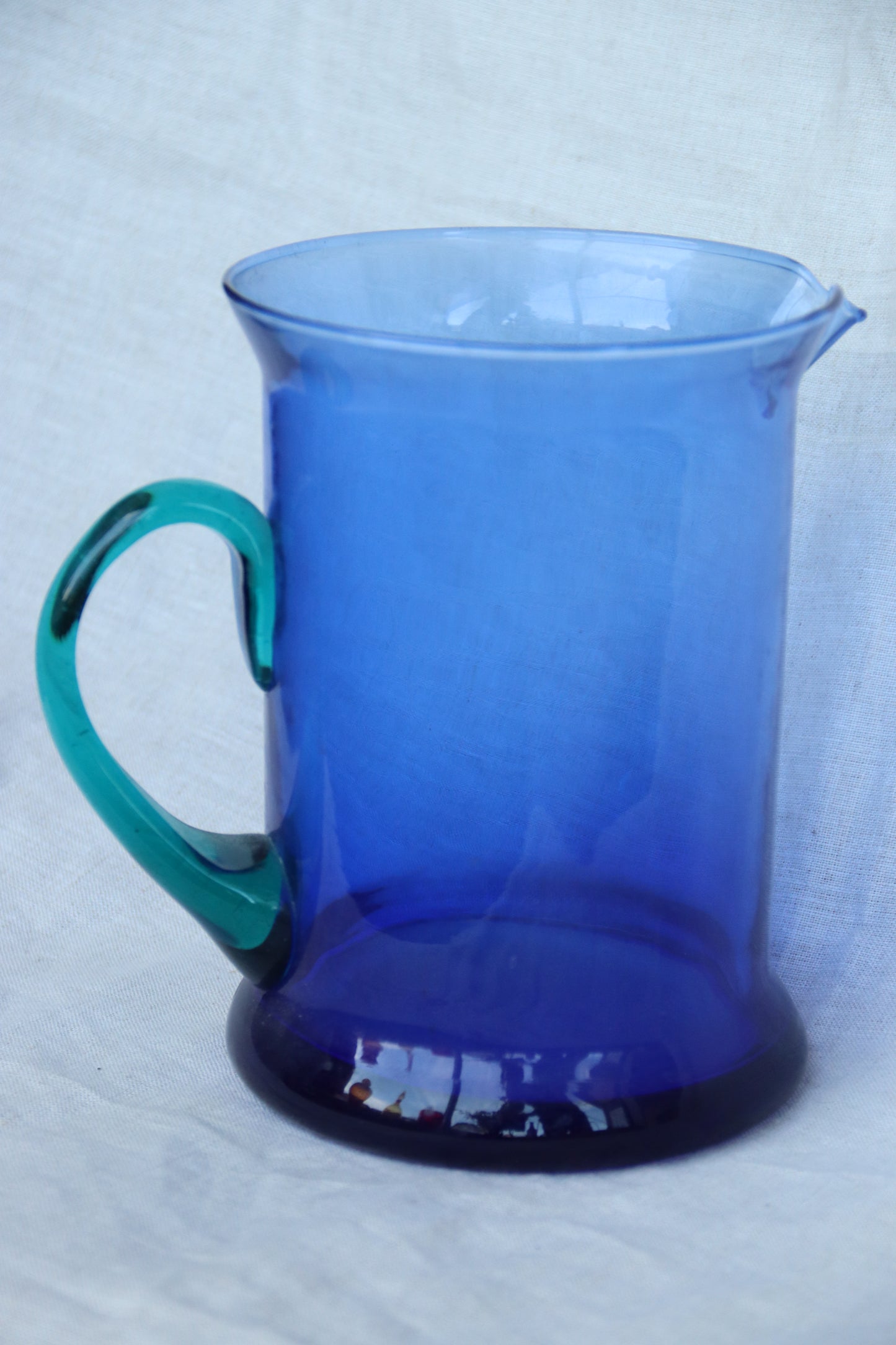 Vintage Blue Glass Pitcher with Teal Handle