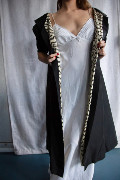 Black silk taffeta evening coat with animal print lining