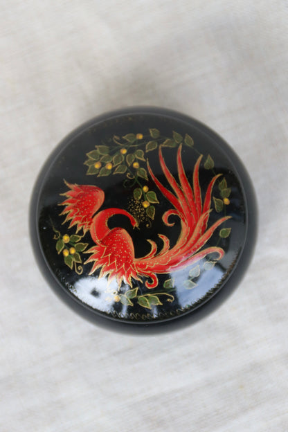 vintage Soviet-era hand-painted black lacquer trinket box with a red and gold Firebird or Phoenix design
