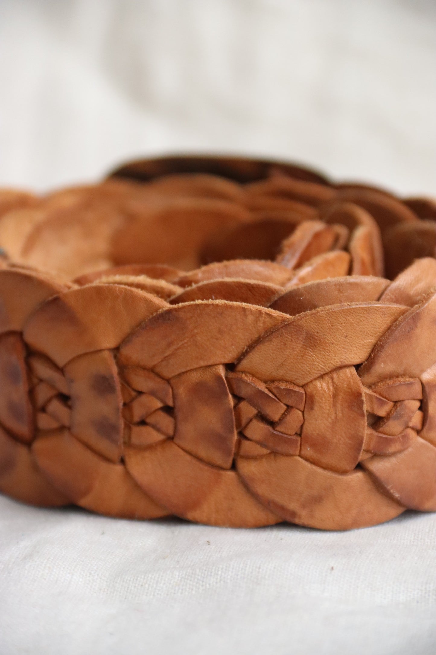 Brown braided leather belt with silver buckle