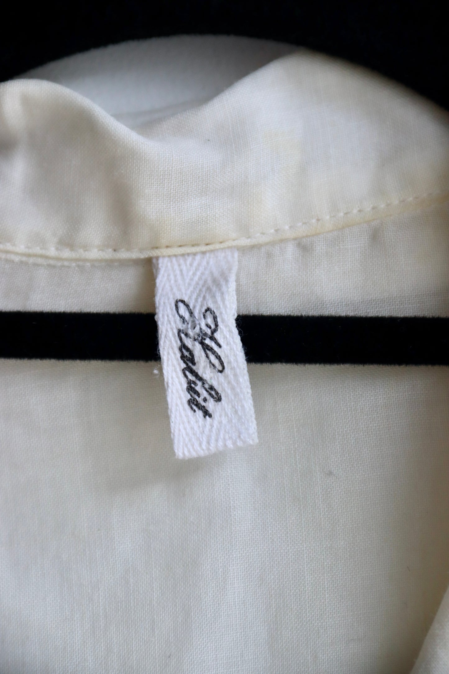 White Top with Mismatched Buttons