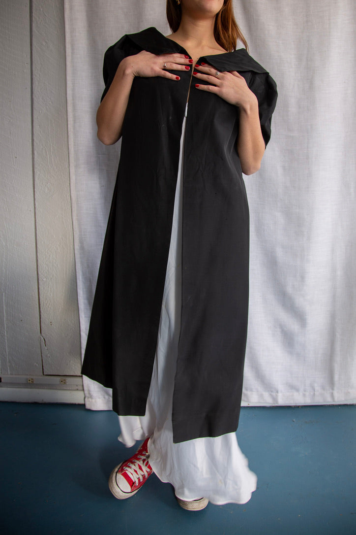 Black silk taffeta evening coat with animal print lining
