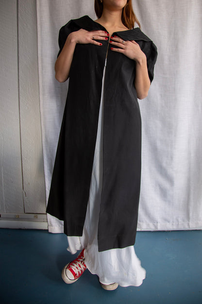 Black silk taffeta evening coat with animal print lining