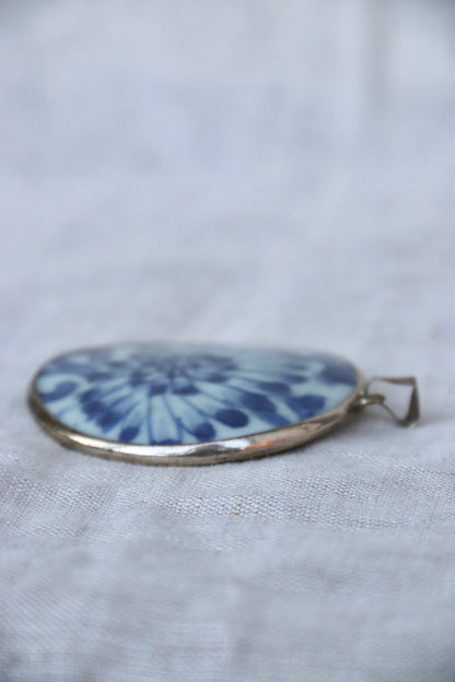 blue and white porcelain shard and silver pendant