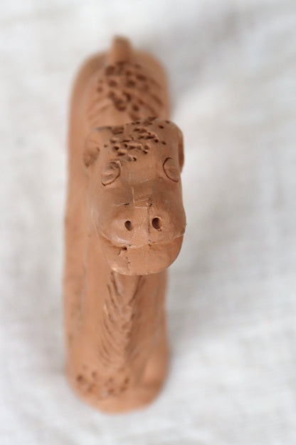 Hand-sculpted red earthenware clay figurine