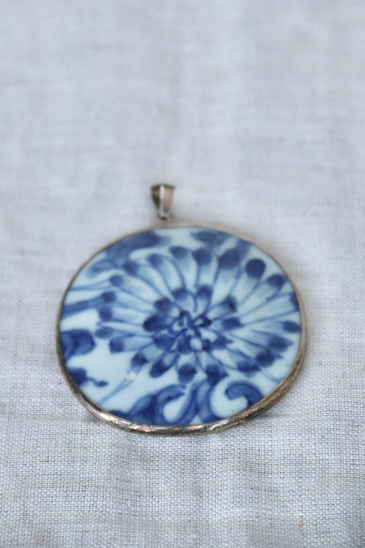 blue and white porcelain shard and silver pendant