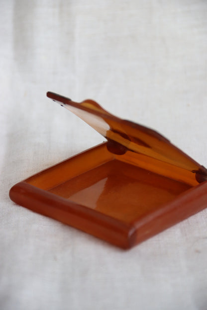 amber-colored Bakelite box