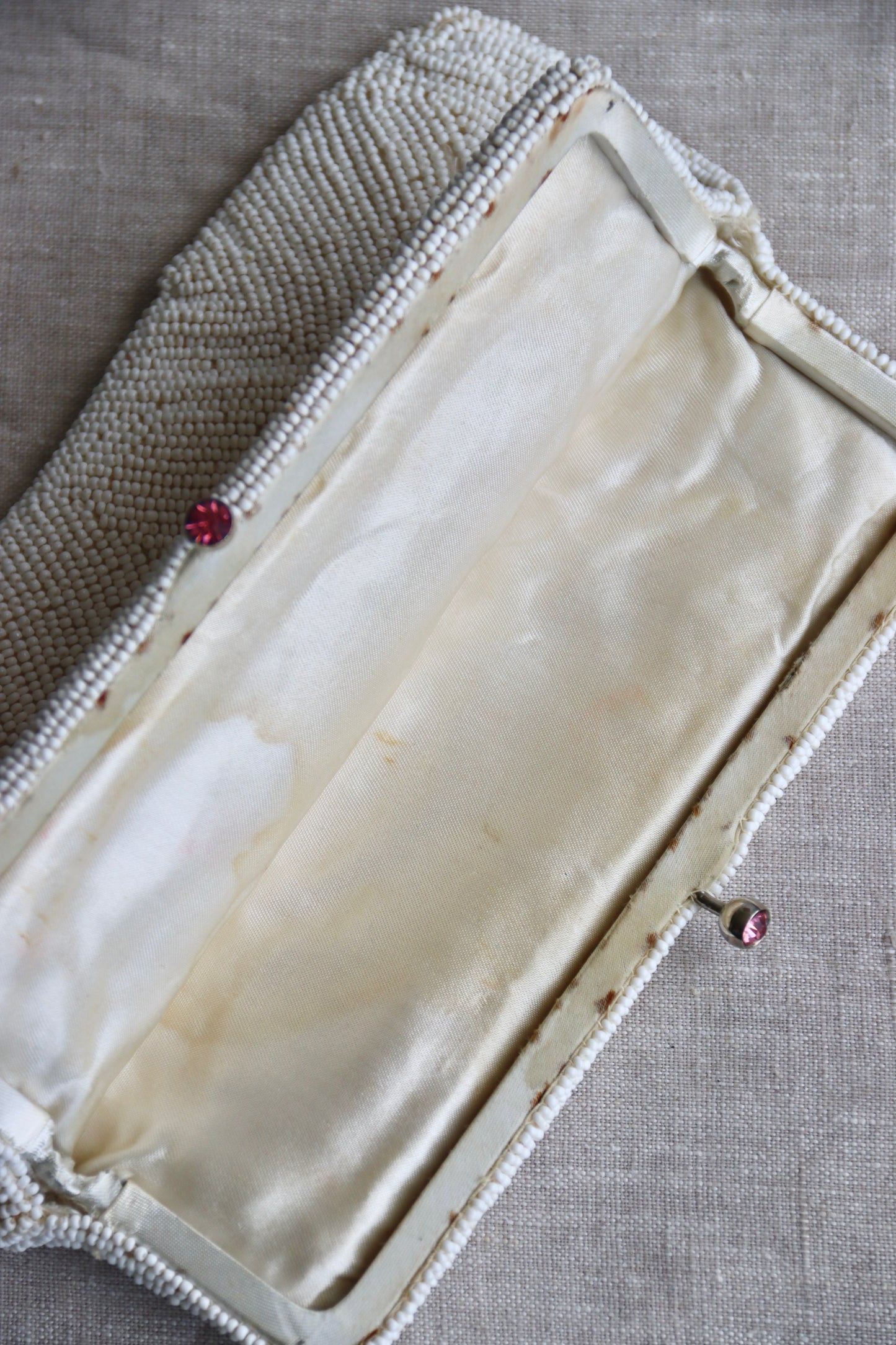 White Beaded Kisslock Clutch with Pink Rhinestones