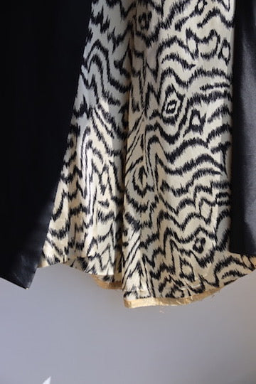 Black silk taffeta evening coat with animal print lining