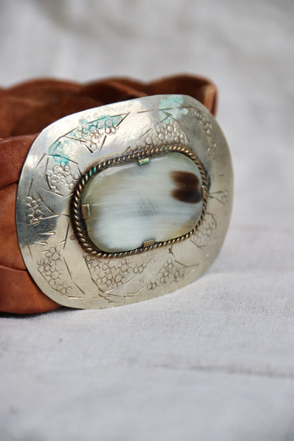 Brown braided leather belt with silver buckle