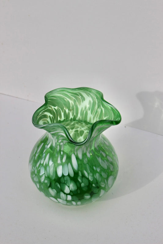 Green with white spatter glass hand blown vase with wavy rim