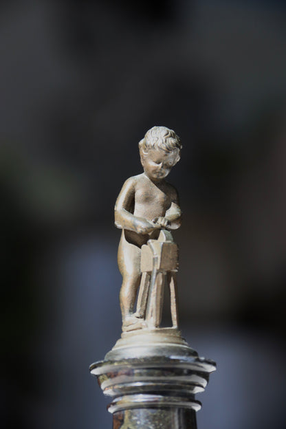 Miniature Bronze Figurine of Cupid Sharpening His Points on Marble Pedestal