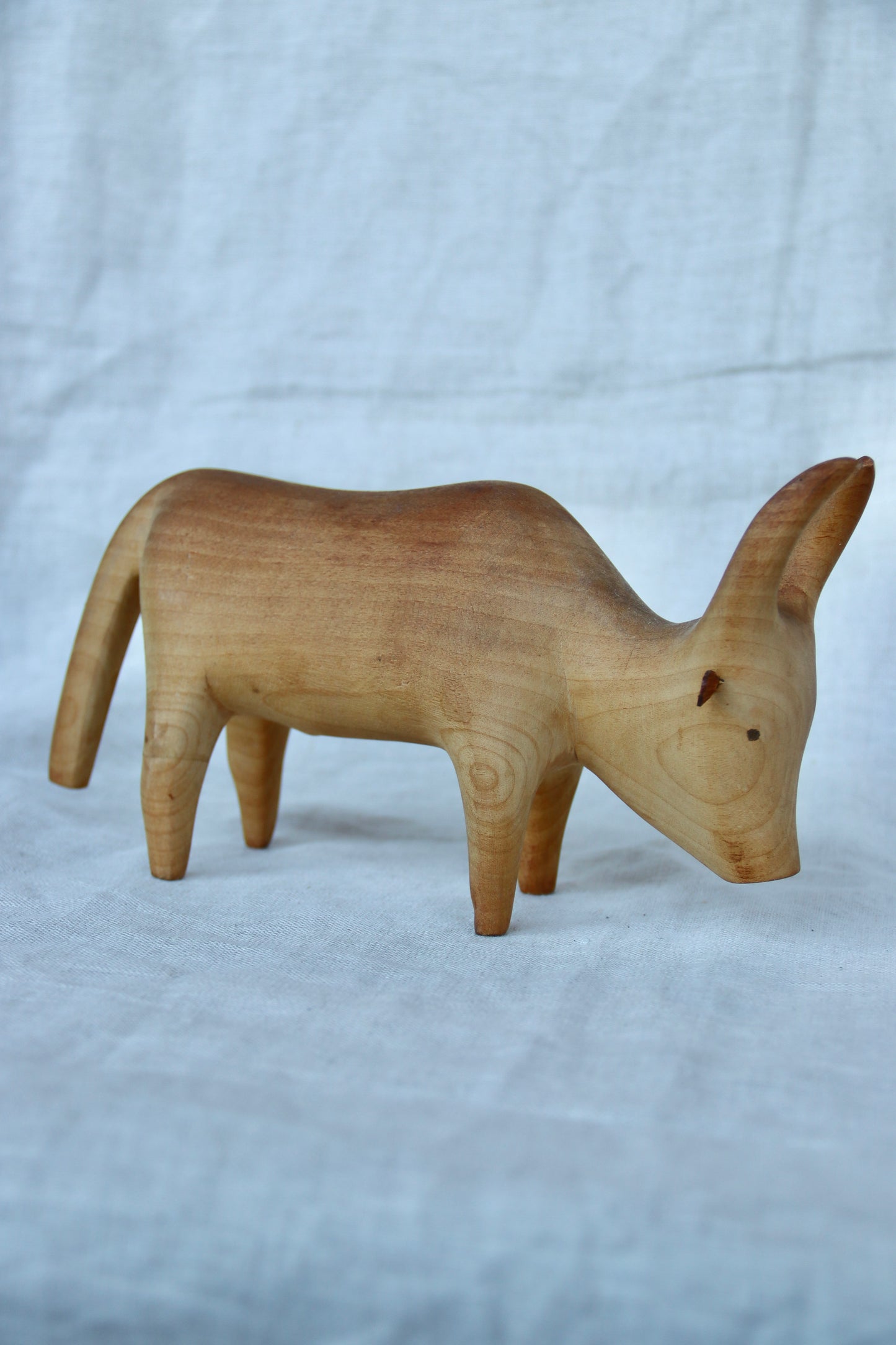 hand-carved wooden Brahma bull figurine