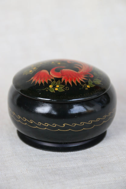 vintage Soviet-era hand-painted black lacquer trinket box with a red and gold Firebird or Phoenix design