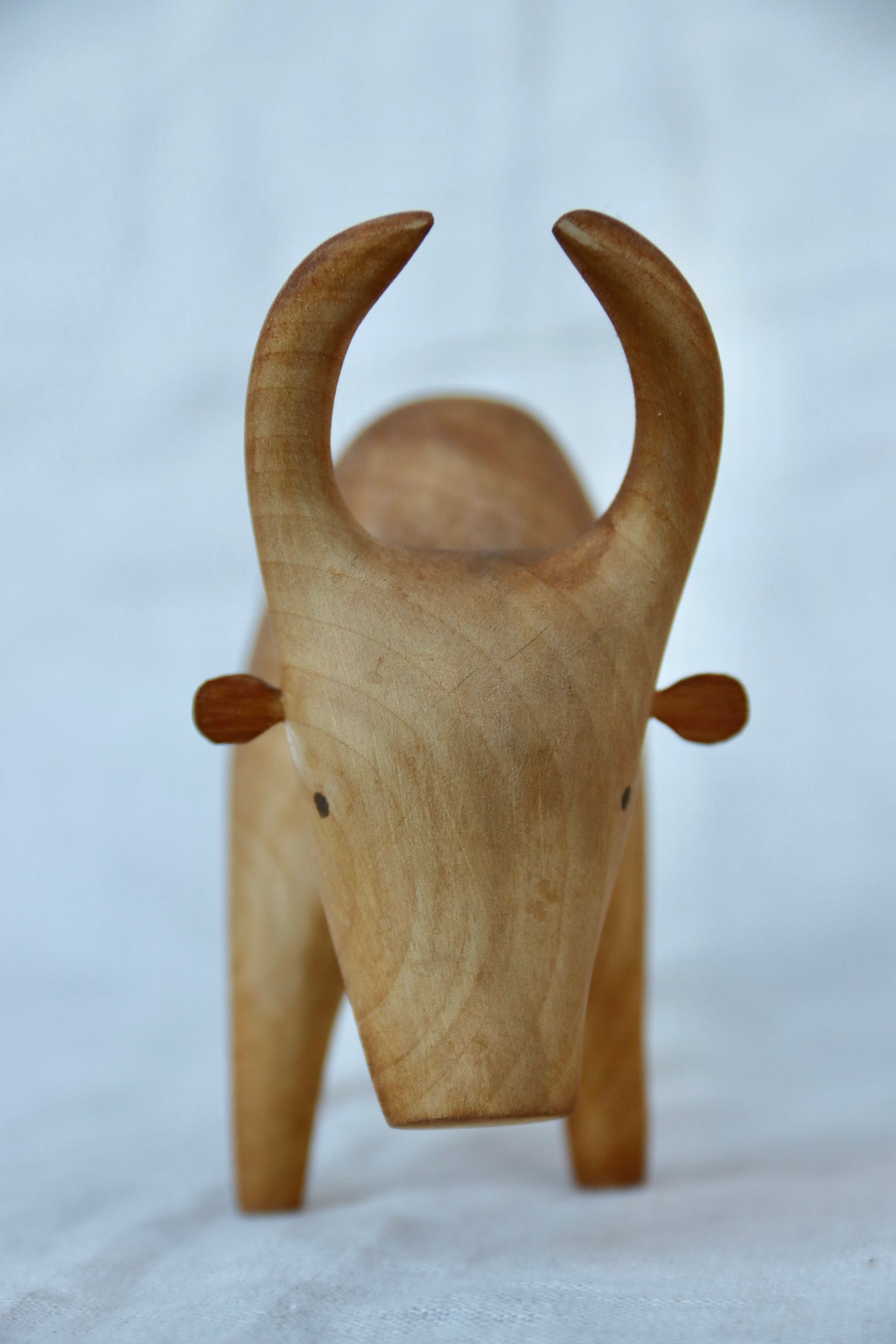 hand-carved wooden Brahma bull figurine