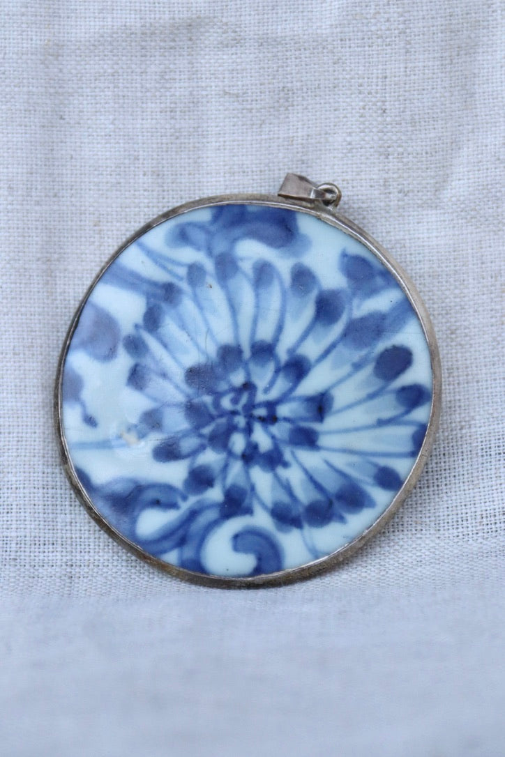 blue and white porcelain shard and silver pendant