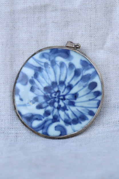 blue and white porcelain shard and silver pendant