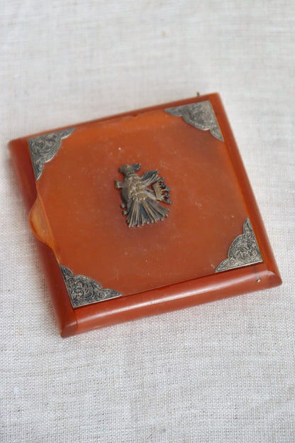 amber-colored Bakelite box