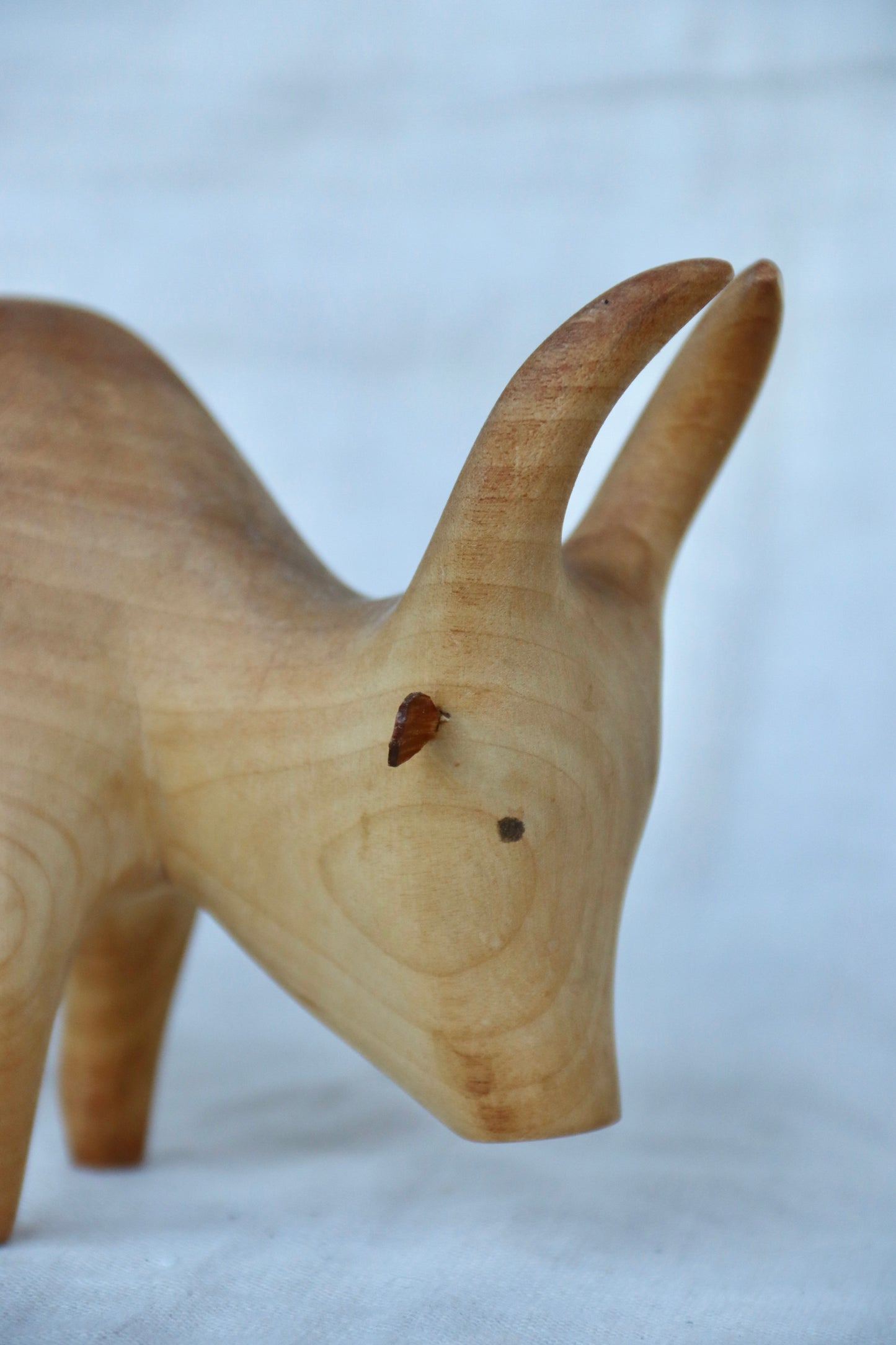 hand-carved wooden Brahma bull figurine